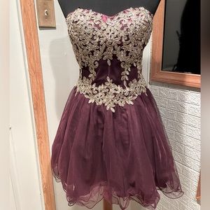 Gorgeous plum colored strapless corset dress with gold embroidery